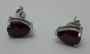 A pair of stud earrings