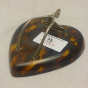 A silver and tortoiseshell letter clip