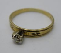 A 10 K gold and diamond ring