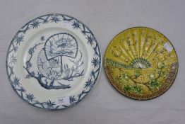 A Victorian Majolica plate of fan form and another Victorian plate decorated with fans