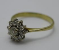 An unmarked gold and diamond cluster ring