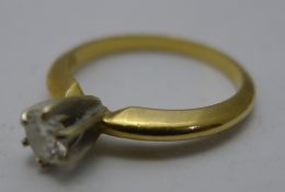 A 14 ct gold and diamond ring