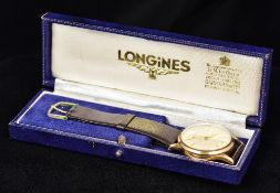 A 9 ct gold Longines gentleman's wristwatch The white dial with Arabic numerals and batons,