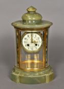 A Victorian cloisonne decorated onyx four glass clock Of domed oval form,
