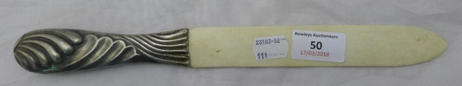 A silver handled paper knife