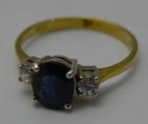 A 9 ct gold three stone ring