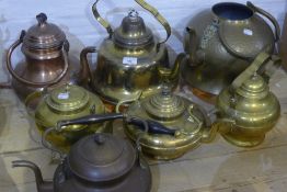 Seven copper and brass kettles