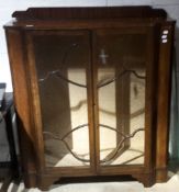 An early 20th century glazed display cabinet