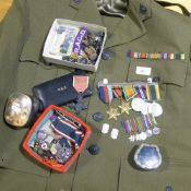 A military uniform and WWII medal bar, with the 1939-1945 Star and the Burma Star, with miniatures,