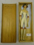 A Victorian papier mache and leather doll