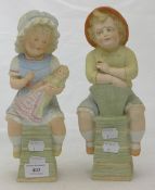 A pair of 19th century bisque porcelain figures of children,