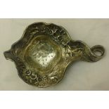 An Art Nouveau silver tea strainer