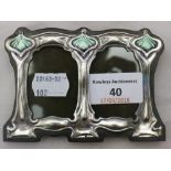 An Art Nouveau style sterling silver and enamel double photograph frame