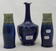 A pair of small Royal Doulton stoneware vases and another
