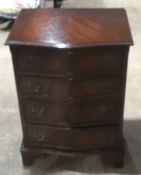 A serpentine mahogany chest