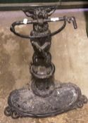 A Victorian cast iron stick stand formed as a dog