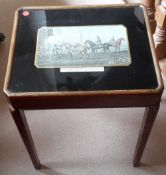 A side table with a racing scene print
