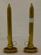 A pair of brass candlesticks