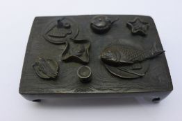 A Chinese bronze model of a table
