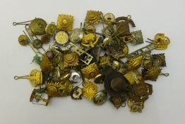 A quantity of regimental cap badges, etc.