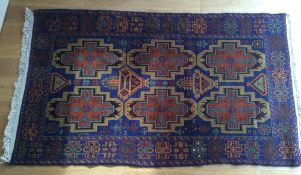 A Caucasian wool rug,
