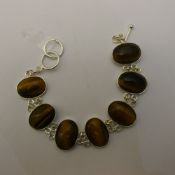 A silver and tigers eye bracelet