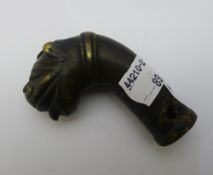 A patinated bronze handle formed as a tiger