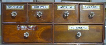 A Victorian bank of apothecary drawers