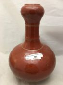 A red ground Chinese vase