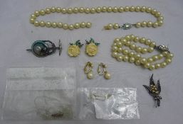 An Oberammergau souvenir brooch, simulated pearl necklaces, seed pearls, etc.