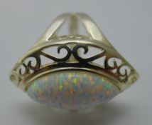 A silver and opal ring