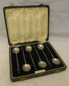 A cased set of silver coffee bean spoons