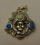 A silver Art Nouveau style opal pendant