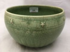 A Chinese porcelain jardiniere With allover celadon crackle glaze. 11 cm high.