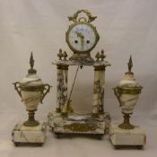 A three piece marble clock garniture