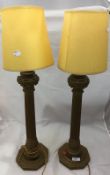 A pair of gilt wood table lamps