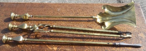 A quantity of brass fire irons