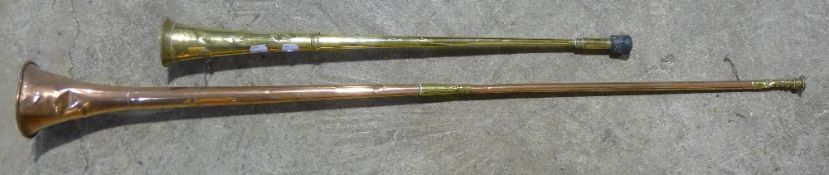 A copper hunting horn and another,