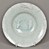 A Chinese Song dynasty dish With lappet rim centred with relief moulded fish,