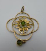 An Edwardian 9 ct rose gold peridot pendant