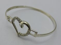 A silver heart bangle