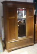 An Edwardian mahogany mirrored door wardrobe