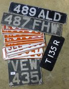 A quantity of vintage number plates