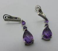 A pair of silver and amethyst earrings