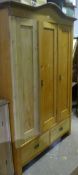 A 19th century Continental pine triple wardrobe