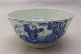 An Oriental blue and white tea bowl,