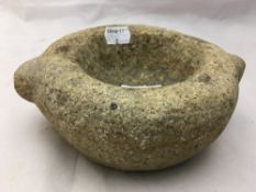 A gritstone or granite antique mortar