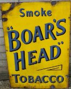 A 'Smoke BOAR'S HEAD Tobacco' enamel advertising sign