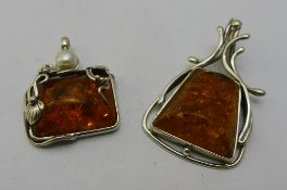 Two silver dress pendants