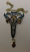 A large Art Nouveau style silver and enamel pendant